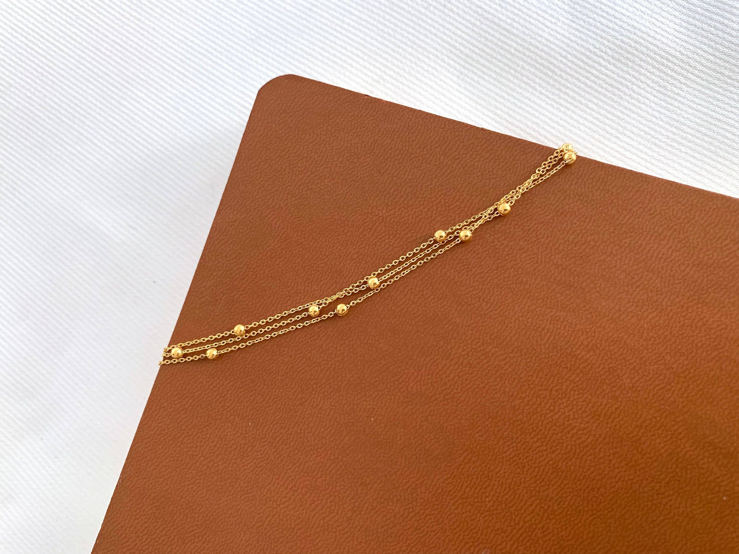 Women's stainless steel triple row chain bracelet