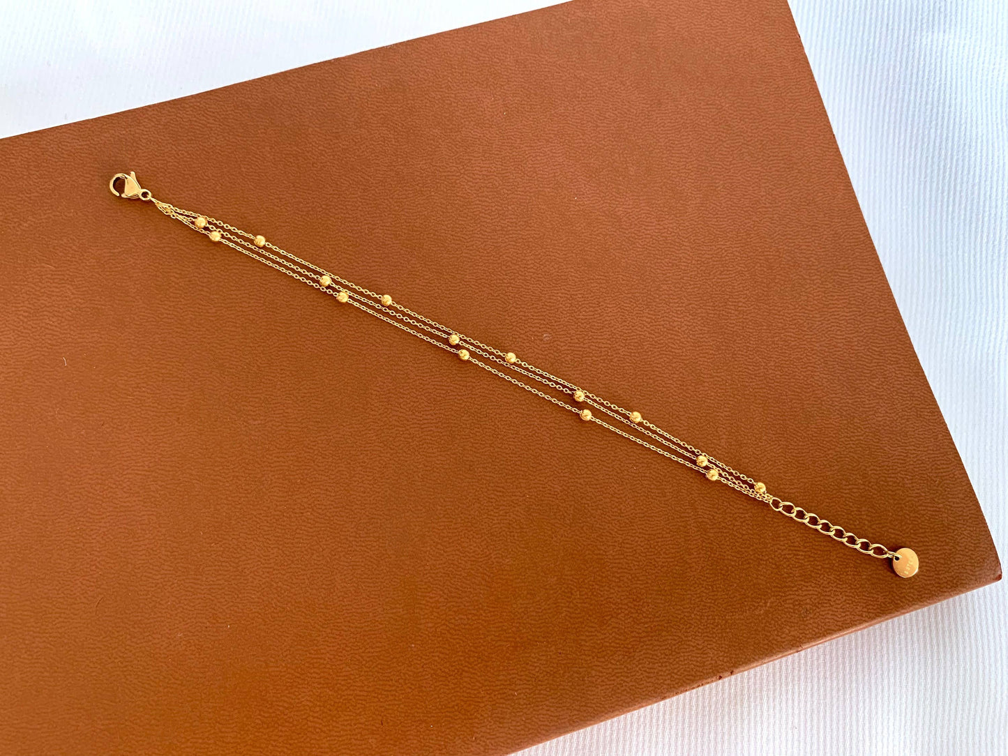 Women's stainless steel triple row chain bracelet